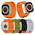 Collection of smartwatches with various orange straps on a white background
