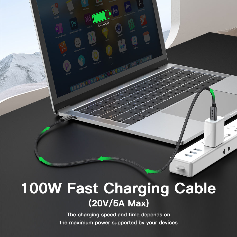 High-speed charging setup showing the AXYON 1m cable establishing a 100W Power Delivery connection between a MacBook Pro and a high-output GaN wall charger on a desk.