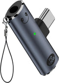 A dark gray metallic USB-C to USB-A adapter with a wrist strap, featuring a small green LED indicator light and a 'PD 100W' label on the side.
