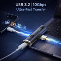 USB adapter connecting to a laptop with text 'USB 3.2 | 10Gbps Ultra-Fast Transfer' on a dark background.