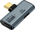 A USB 3.2 10Gbps to PD 100W USB-C adapter with a metallic gray body, black accents, and a gold-toned USB-C connector, shown on a plain white background.