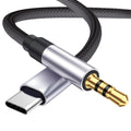 Multifunctional cable with USB-C, 3.5mm jack, and braided design on a white background