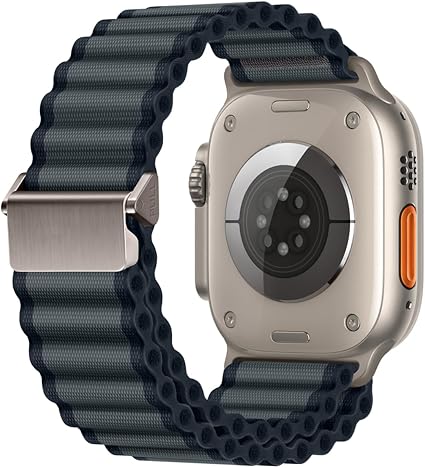 Apple Watch Ultra with a dark grey wide corrugated nylon off-road sports strap and silver metal buckle.