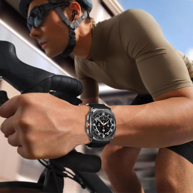 Man riding a road bike while wearing an Apple Watch Ultra with a black AXYON Alpine Loop-style nylon band.