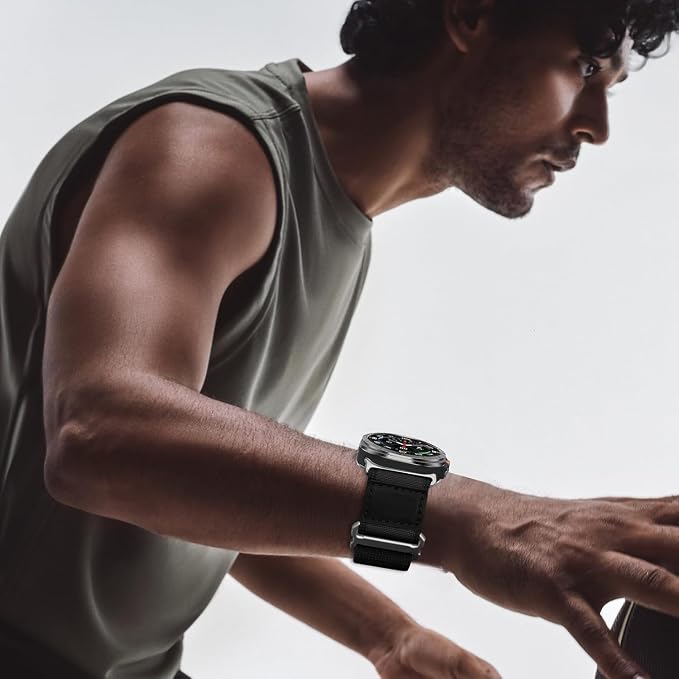 Man wearing a black AXYON Alpine Loop-style nylon watch band on an Apple Watch during a workout.