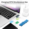 A laptop with a USB-C dongle plugged into its charging port, shown alongside a wall charger and a smartphone on a white background. Text at the top reads 'Charging+OTG Simultaneous Use' and 'Support OTG data transmission+PD fast charging.