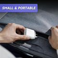A person's hands are shown demonstrating a small white 30W USB charger inside a gray fabric laptop sleeve, with a purple text banner at the top reading 'SMALL & PORTABLE'.