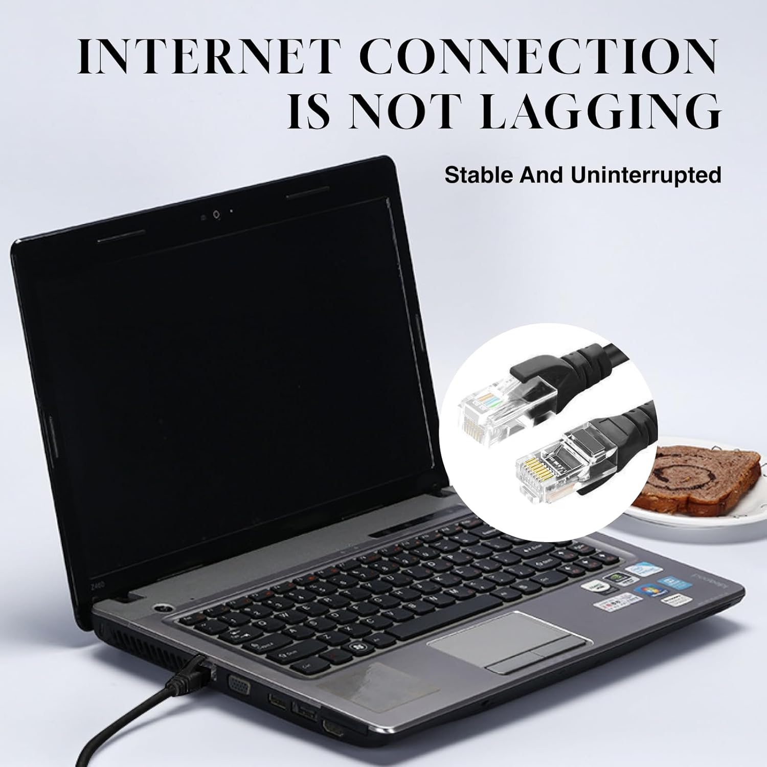 Laptop with Ethernet cable, emphasizing stable internet connection.