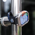 Smartwatch with a colorful display attached to a metal pole