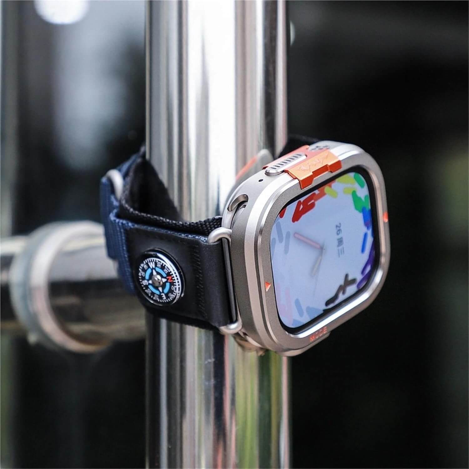 Smartwatch with a colorful display attached to a metal pole