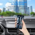 Person using a smartphone with a dashcam mount inside a car, with a cityscape in the background.