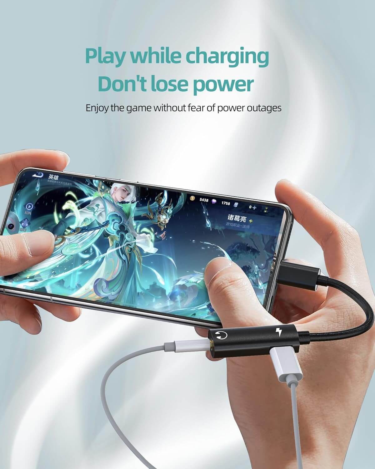 User gaming on smartphone while using USB-C audio adapter, showing play and charge capabilities.
