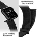 Smartwatch with a black woven band on a light gray background