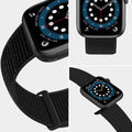 Black smartwatch with a textured black band on a light gray background