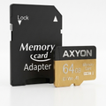 AXYON 64GB Premium microSD card with its black adapter and a small gold-and-black card, shown on a clean white background.