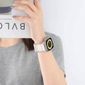 Lifestyle Shot – Apple Watch with Light Band – Starlight woven nylon Alpine Loop‑style strap, casual wear.