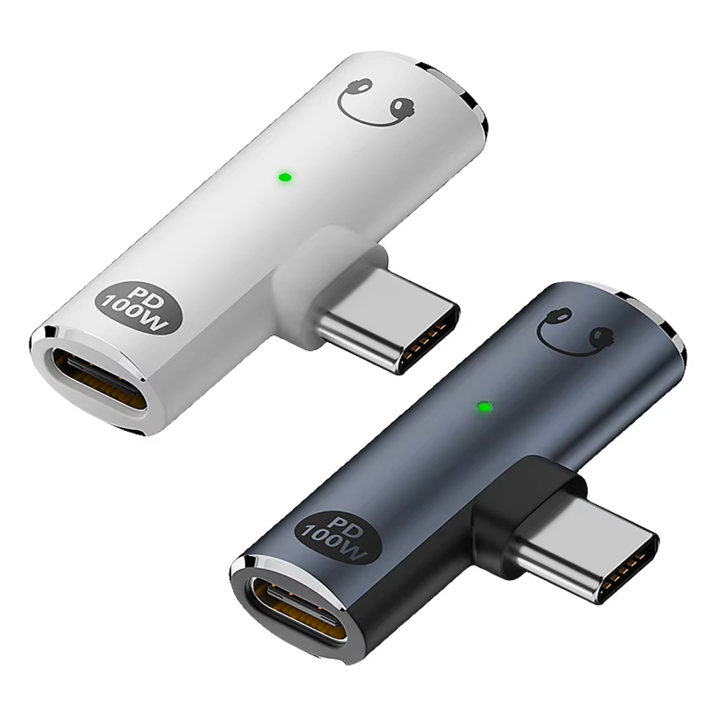Two USB-C adapters, one white and one black, on a white background.