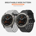 Two smartwatches with black faces and metallic bezels on white background