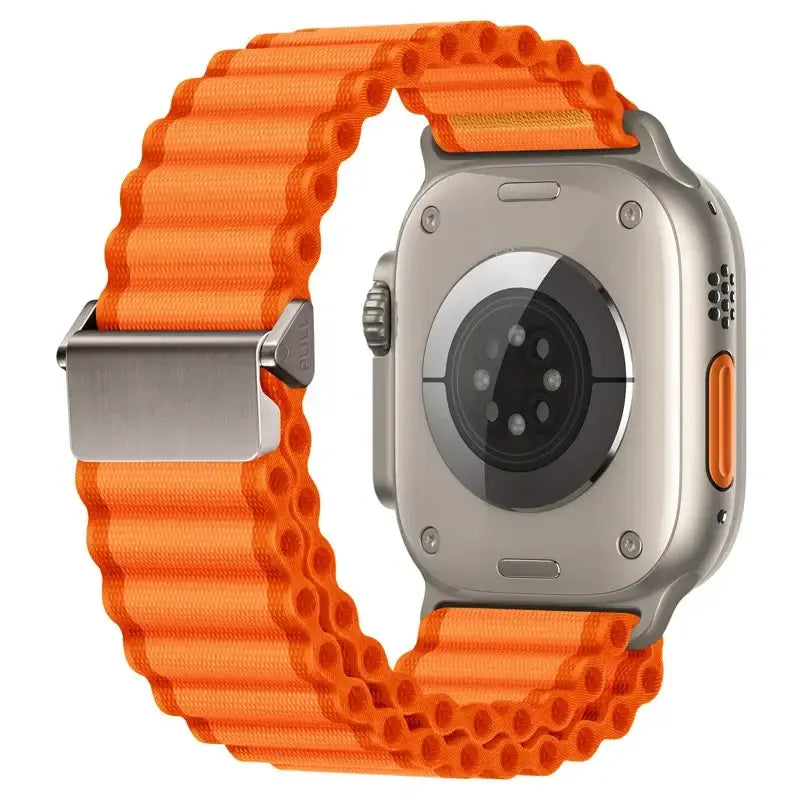 Orange wide corrugated nylon off‑road sports strap for Apple Watch with silver buckle.