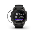 Hands applying AXYON® soft film screen protector to Garmin Fenix 8 watch