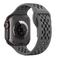 Smartwatch with a gray perforated band on a white background