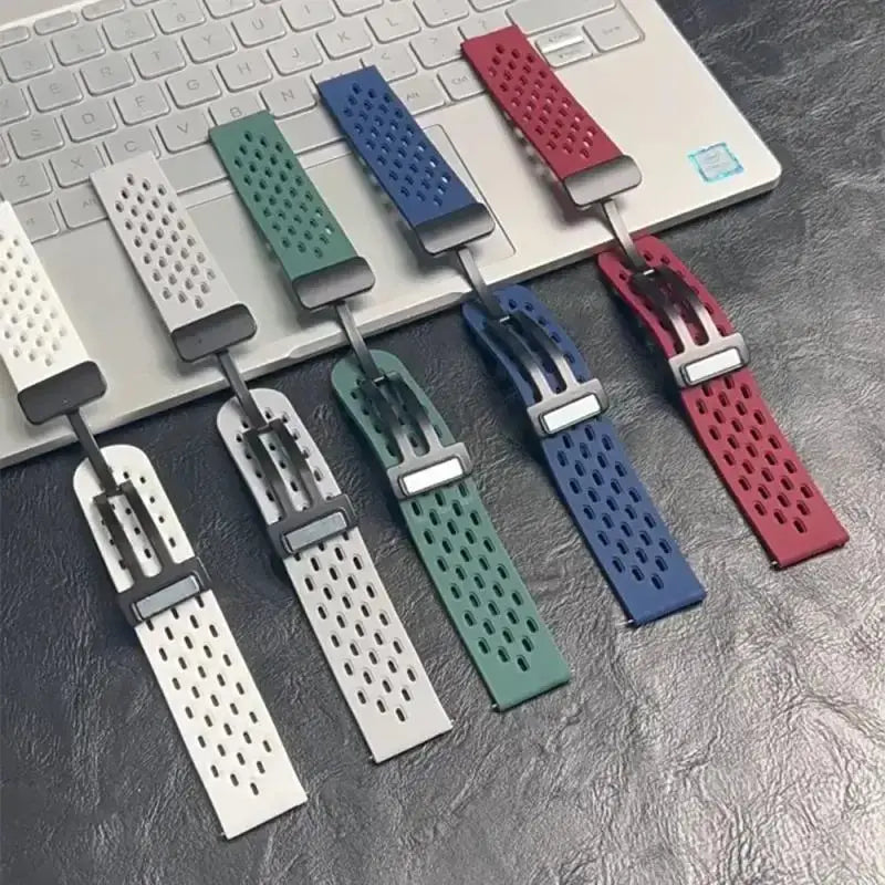 Set of colorful watch straps on a metallic surface