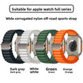 Four watch bands in dark gray, white, green, and orange with text indicating compatibility for Apple Watch and material details.