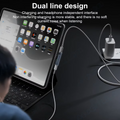 A dual-line charging setup with a tablet on a keyboard case, a white cable running from the tablet to a wall charger, and overlaid marketing text about charging and headphone independence. A person is partially visible from the side, seated at the desk.