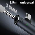 A 3.5mm universal adapter cable shown close-up against a dark background, with white text reading '3.