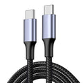 Close-up of AXYON USB-C cable showing premium metallic aluminum connectors and durable braided cord design