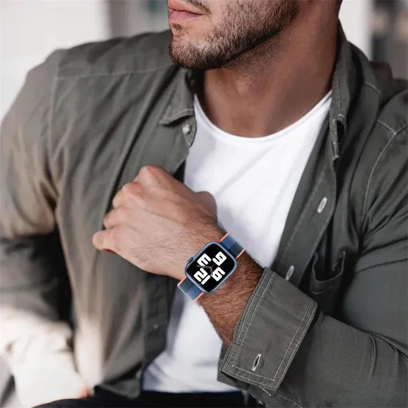 Man wearing a smartwatch on his wrist with a blurred background