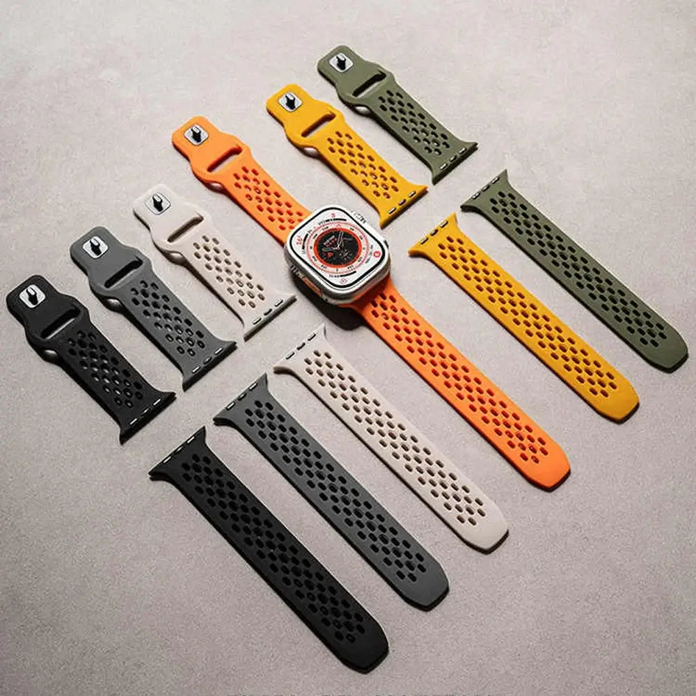 Set of various watch straps on a gray surface