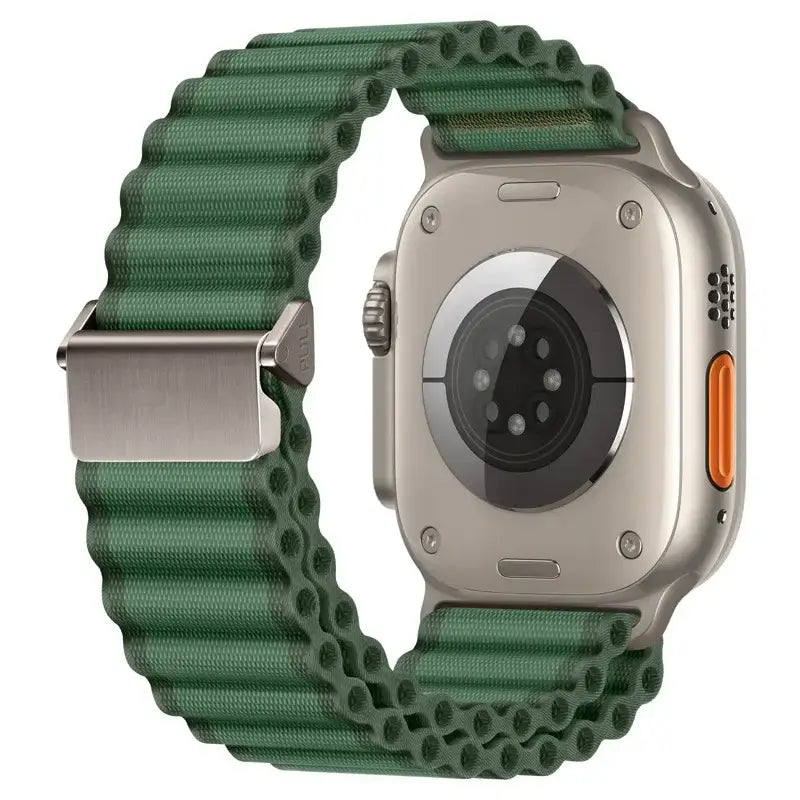 Green wide corrugated nylon off‑road sports strap for Apple Watch with silver buckle.