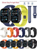 Collection of silicone watch straps for Apple Watch in various colors and designs.