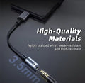 3.5mm audio cable with smartphone on a dark background, highlighting high-quality materials.