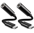 Two black audio adapters with USB-C connectors on a white background