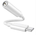 White USB-C adapter on a white background