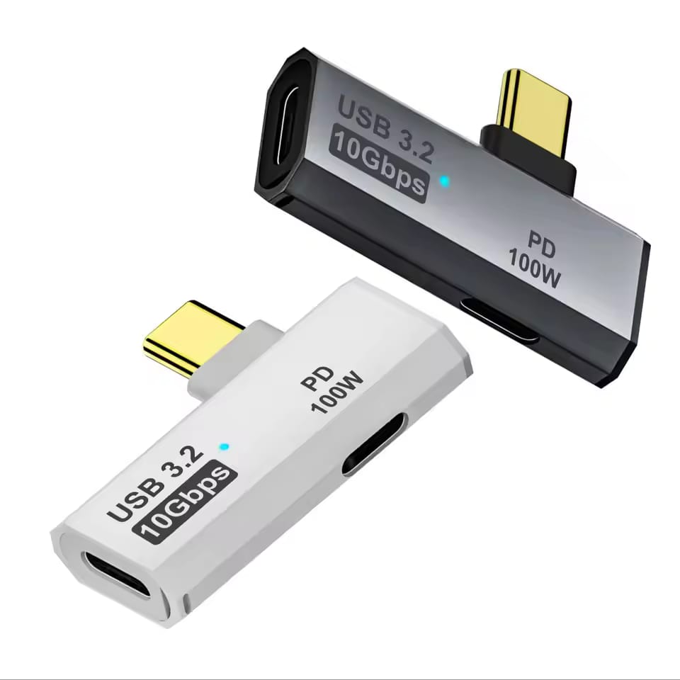 Two USB-C adapters, one black and one white, on a white background.