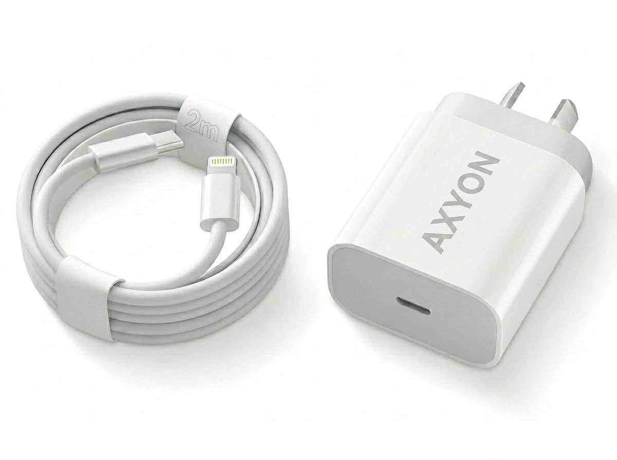 A white AXYON USB-C fast charger shown next to its coiled white Lightning cable on a clean white background.