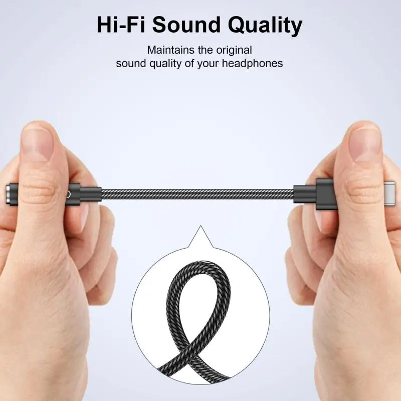 Hands holding a black audio cable with 'Hi-Fi Sound Quality' text on a light gray background