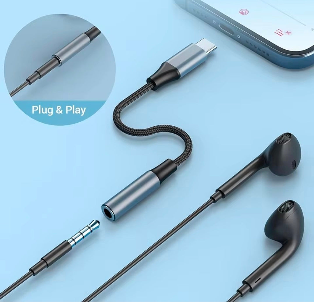 Headphones with a cable adapter on a light blue background