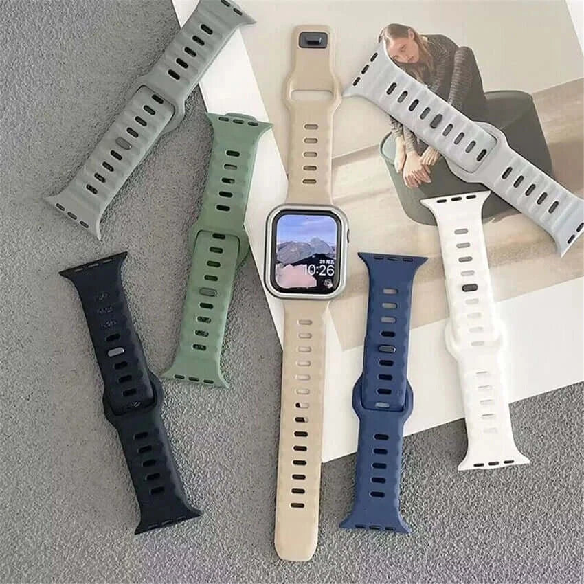 Collection of different colored watch straps displayed on a flat surface.