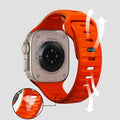 Smartwatch with an orange band on a light gray background