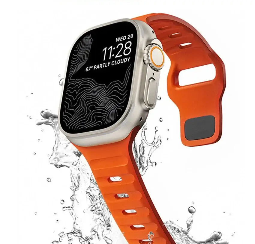 Smartwatch with an orange band splashing in water