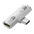 White USB-C adapter with audio and power indicators on a white background